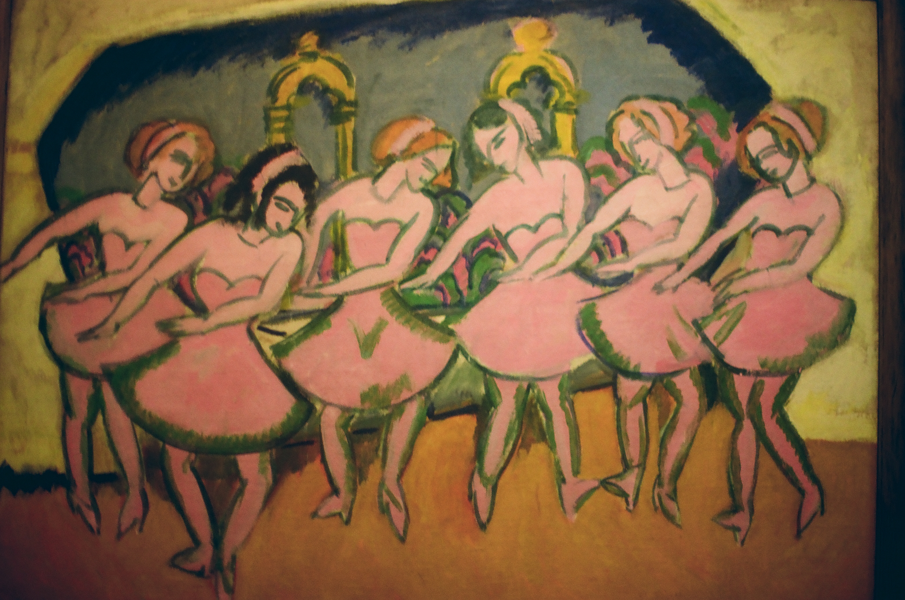 A painting shows six dancers in pink dresses bending forward in a row, with two golden arches on a blue-grey backdrop behind them.